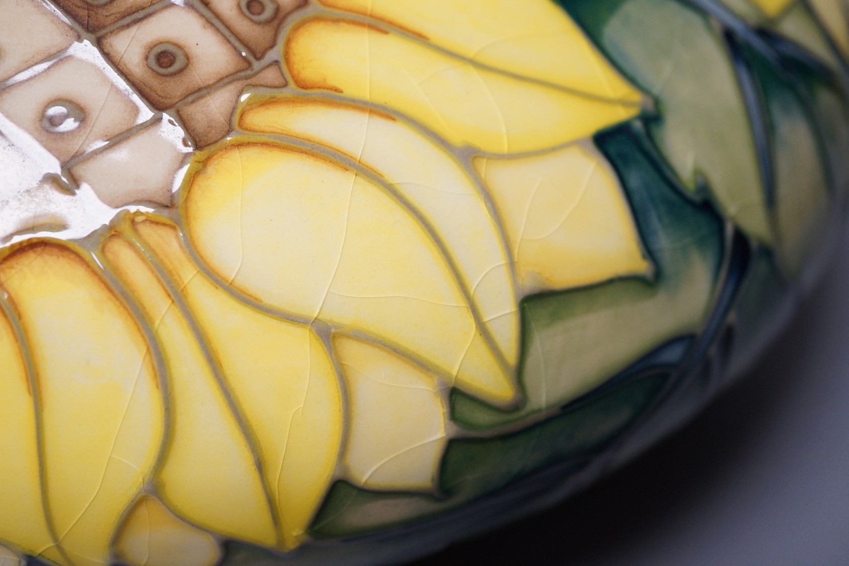 A Moorcroft pottery vase of compressed form, decorated in the 
